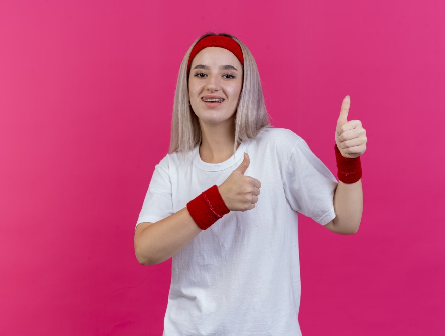 girl showing thumbs up