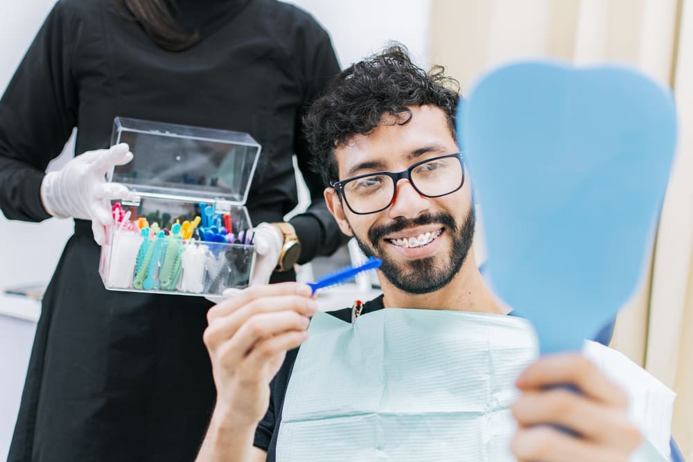 patient selecting rubber band for braces