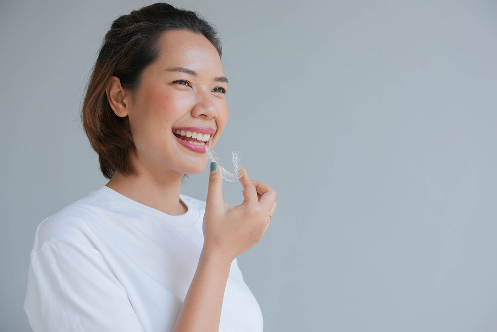 woman wearing invisalign